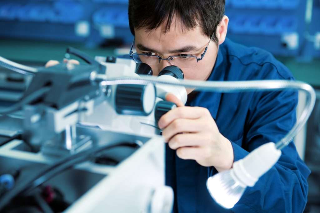 Materials scientist examining advanced semiconductor materials