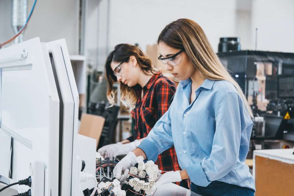 Manufacturing employee sorting voltage converters and electronic components