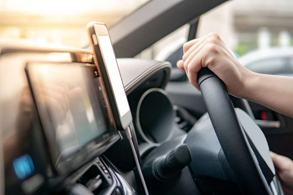 Navigation equipment powered by a car battery through a voltage converter