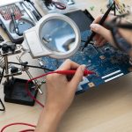 Quality manager reviewing electronic component authenticity and supplier data on a global sourcing platform