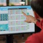 Procurement manager reviewing electronic component pricing dashboard on digital marketplace platform